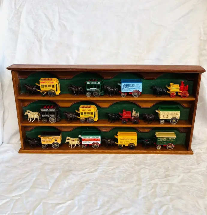 Collection of 12 Vintage Ledo die-cast Horse Drawn Wagons & wooden Display Case. 64cm