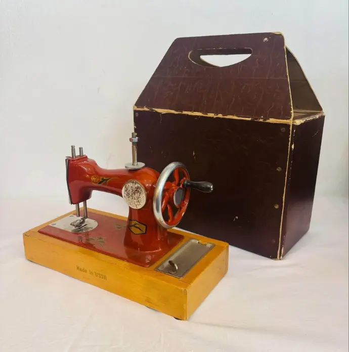 Vintage heavy cast iron sewing machine toy with original box. Made in USSR. Working.