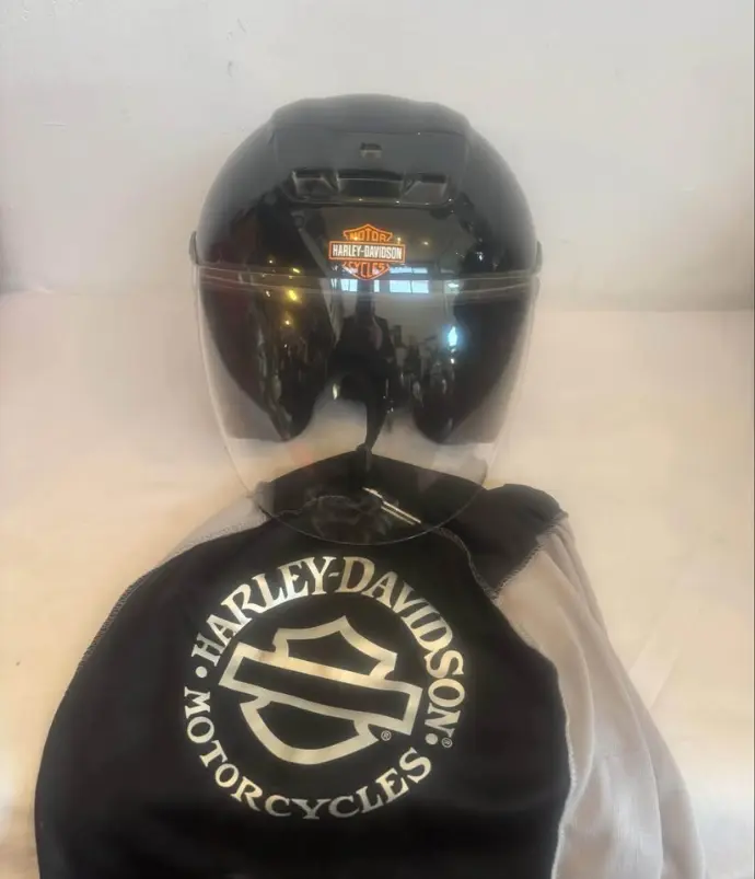 Harley Davidson Motorcycle helmet with bag. 33x25x22cm. Good condition.