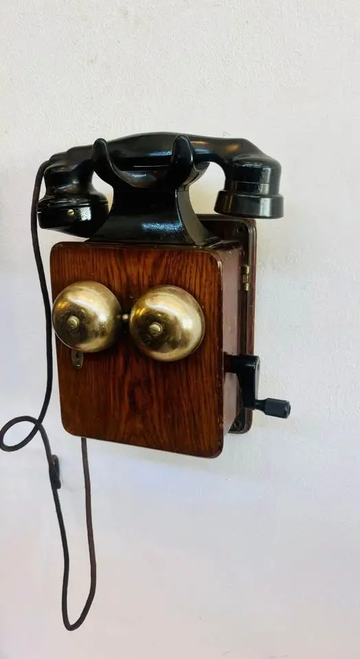 Antique Dated 1945 wooden and bakelite wall mounted telephone. 30x25x13cm