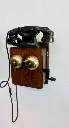 Antique Dated 1945 wooden and bakelite wall mounted telephone. 30x25x13cm