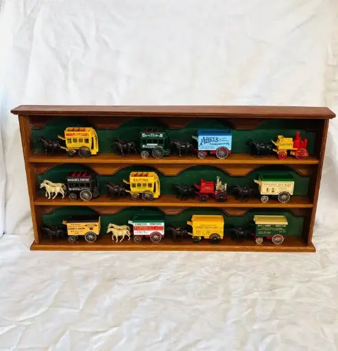 Collection of 12 Vintage Ledo die-cast Horse Drawn Wagons & wooden Display Case. 64cm