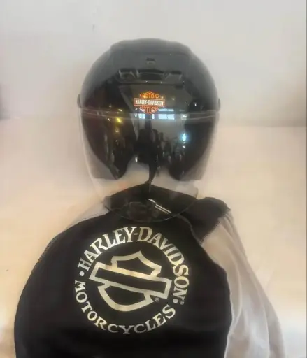 Harley Davidson Motorcycle helmet with bag. 33x25x22cm. Good condition.