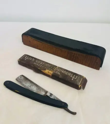 Antique Solingen Razor in original box with Wooden & Leather Sharpener. 24cm & 16cm