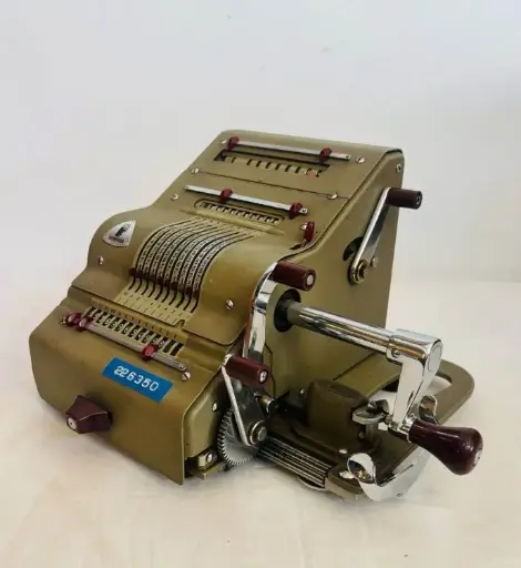 Antique 1940-50’s Brunsviga cast iron adding/machine in Mint condition working with case. 28x24x17cm
