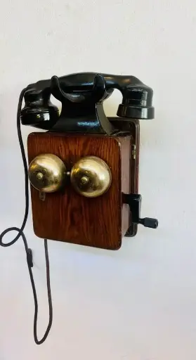 Antique Dated 1945 wooden and bakelite wall mounted telephone. 30x25x13cm