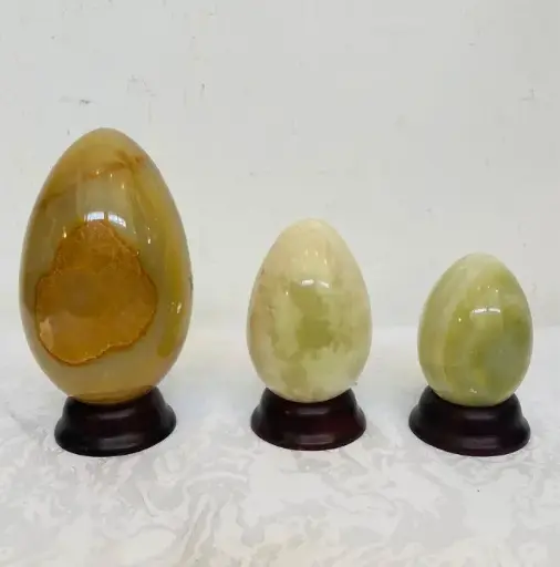 Collection of 3 vintage large onyx stones eggs on wooden stand!