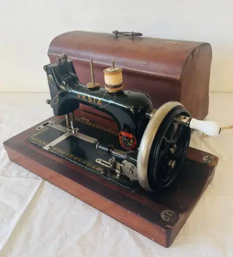 Antique 1910-20’s German Vesta cast iron sewing machine (good working condition) with wooden box. 40cm